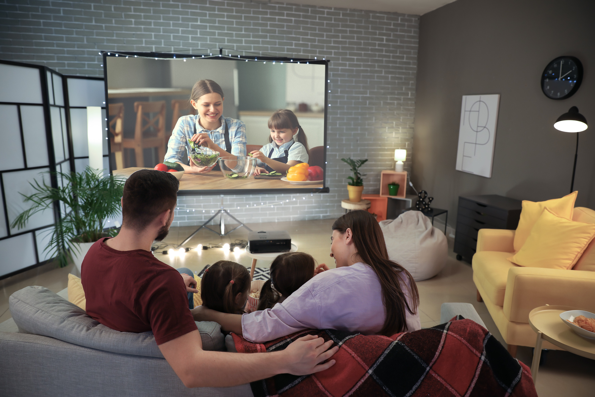 Young Family Watching Movie at Home